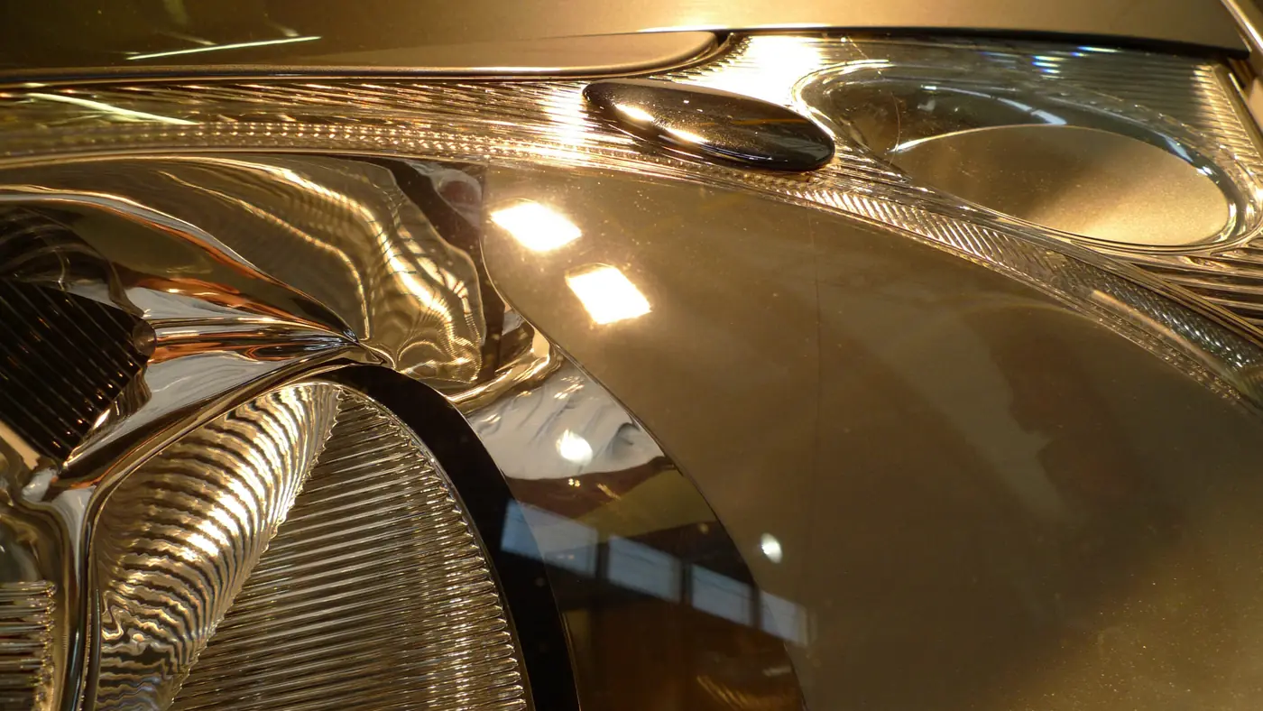 Headlamp reflections on polished paint