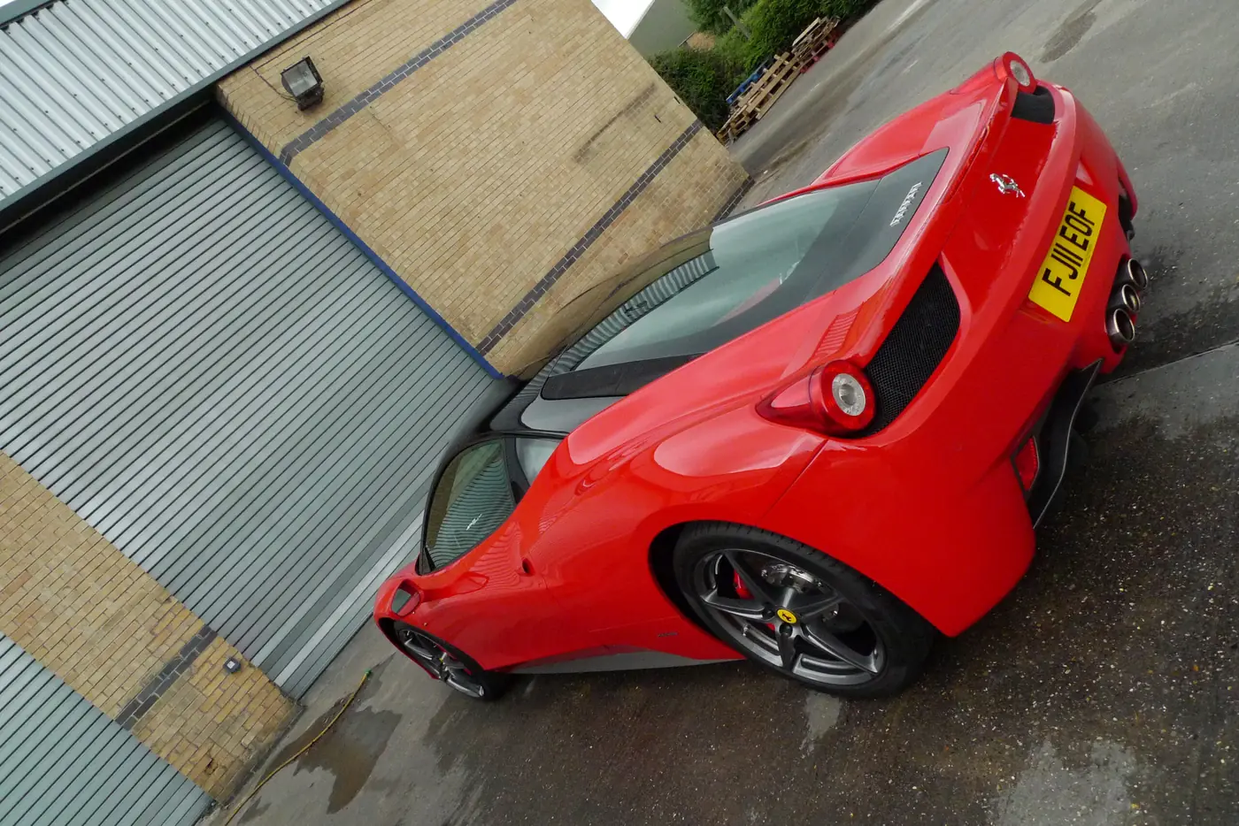 Red Ferrari 458 Italia, rear three-quarter