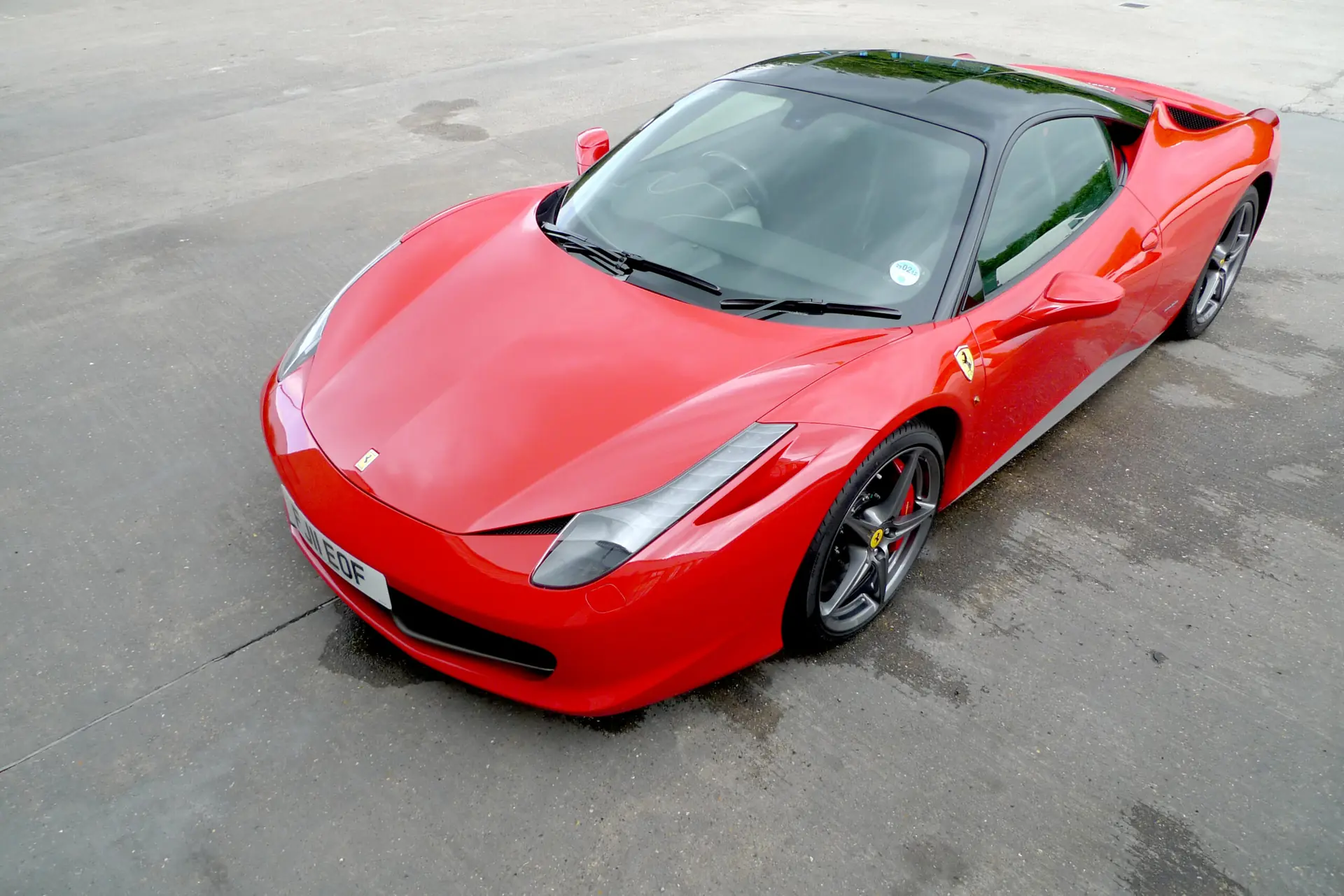 Red Ferrari 458 Italia outside the studio
