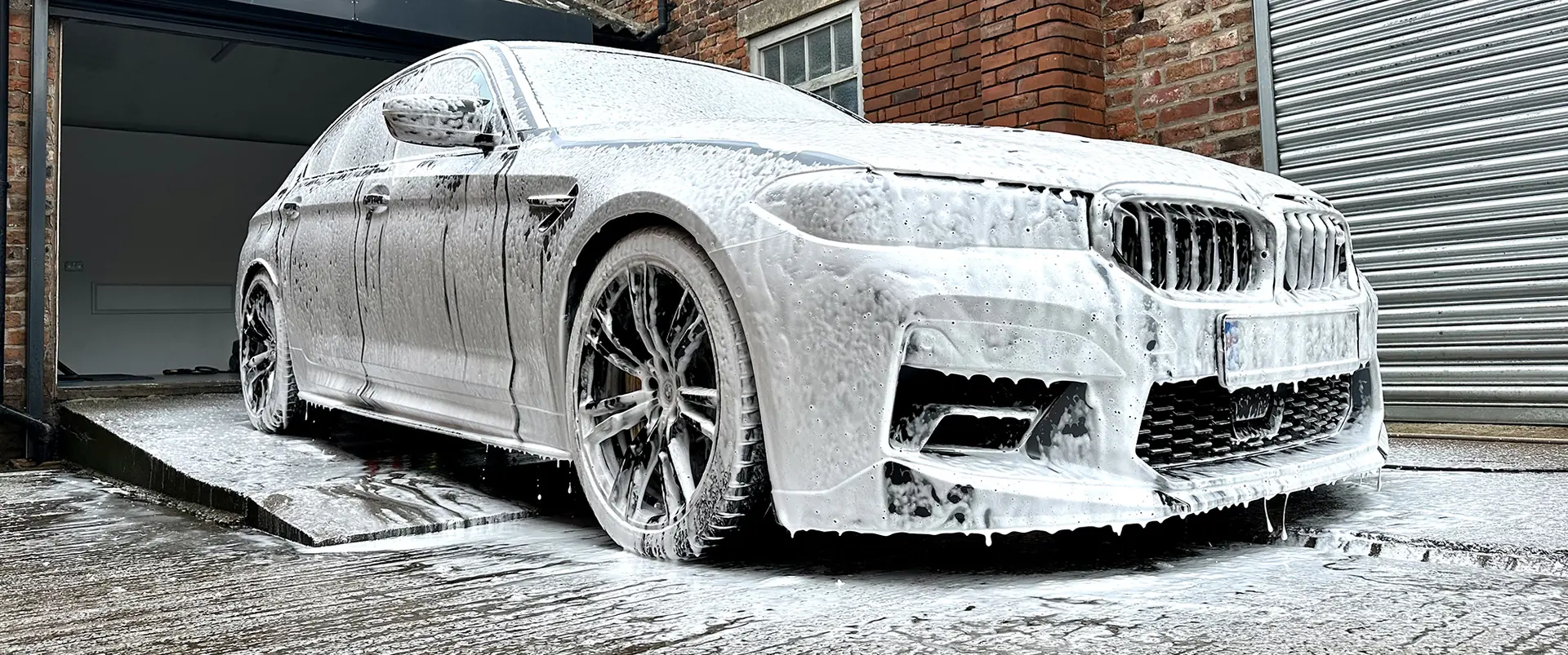BMW M5 covered in snow foam during a Car Spa wash